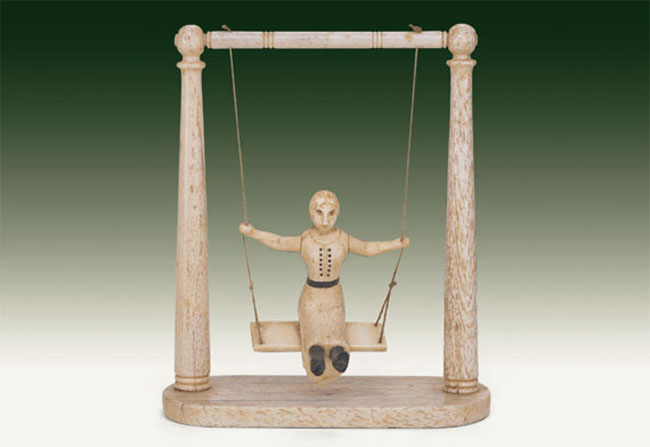 A Sailor-Made Miniature Whalebone Child's Swing with Girl